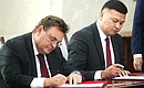 Minister of Justice Konstantin Chuichenko and Minister of Justice of Kyrgyzstan Ayaz Baetov (right) during the ceremony for signing joint documents, held as part of President Putin’s official visit to Kyrgyzstan. Photo: Sergei Karpukhin, TASS