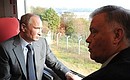 Во время поездки в новом поезде «Ласточка». С президентом компании «Российские железные дороги» Владимиром Якуниным.