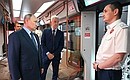 Looking over the upgraded Moscow-2020 carriage with Moscow Mayor Sergei Sobyanin (centre) and train operator Vladimir Konnov at the Manezh Central Exhibition Hall. Photo by Kristina Kormilitsyna (”Rossiya Segodnya“)