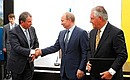 Vladimir Putin oversaw the signing of an agreement between President and Management Board Chairman of Rosneft Igor Sechin (left) and President and Chairman of ExxonMobil Rex Tillerson on joint development of difficult-to-access reserves in western Siberia.