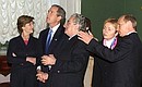 President Putin and George Bush and their spouses on a tour of the State Hermitage guided by its director Mikhail Piotrovsky (centre).