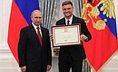 A letter of recognition for contribution to the development of Russia football and high athletic achievement is presented to Russia national football team player Vladimir Granat.