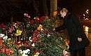 Vladimir Putin lays a bouquet of red roses at the site of the tragedy in memory of the terrorist attack victims.