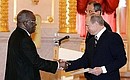 Ceremony for the presentation by foreign ambassadors of their letters of credentials. Ambassador of the Republic of Cote d\'Ivoire Gnango Philibert Fanidi presents his letter of credentials. In the background is Russian Foreign Minister Sergei Lavrov.