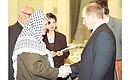 President Putin and Palestinian National Authority President Yasser Arafat.