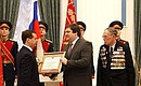 Dmitry Medvedev presented the certificate conferring the title of City of Military Glory on Tikhvin to head of Tikhvin Municipal District Igor Fomin.