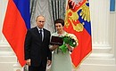 Presenting state decorations to prominent figures in culture and the arts. Honorary title of Honoured Cultural Worker of the Russian Federation is conferred to Surgut Regional History Museum director Maria Selyanina.