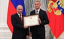 A letter of recognition for contribution to the development of Russia football and high athletic achievement is presented to Russia national football team player Igor Smolnikov.