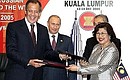In the presence of President Vladimir Putin and Malaysian Prime Minister Abdullah Ahmad Badawi Russian Foreign Minister Sergei Lavrov and Malaysian Minister of International Trade and Industry Rafidah Aziz signed a protocol on the completion of talks regarding Russia\'s accession to the World Trade Organization.
