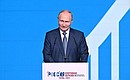 Vladimir Putin attends the plenary sessionof the 11th Russia – Country of Sports International Sports Forum. Photo: Eugeniy Biyatov, RIA Novosti