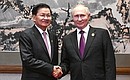 C Президентом Лаоса Тхонглуном Сисулитом. Фото: Сергей Гунеев, РИА «Новости»