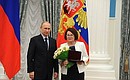 Presenting state decorations to prominent figures in culture and the arts. Honorary title of Honoured Architect of the Russian Federation is conferred to Galina Kolesnikova (Belgorod State Technological University).