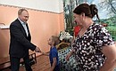Vladimir Putin talking with the Safronov family, who lost their home in the flood.