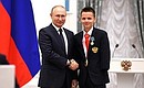 Presenting state decorations to winners of the 2020 Summer Paralympic Games in Tokyo. Paralympic athletics champion Alexander Yaremchuk receives the Order of Friendship. Photo: RIA Novosti