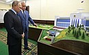 Before the meeting of the Commission on the Strategy for the Development of the Fuel and Energy Industry and Environmental Safety, Vladimir Putin inspected scale models of the facilities planned for construction in Kemerovo. With Acting Governor of the Kemerovo Region Sergei Tsivilev.
