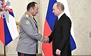 Meeting with service personnel who took part in the anti-terrorist operation in Syria. Major General Gennady Zhidko was awarded the title of the Hero of the Russian Federation.