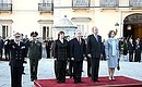 At an official farewell ceremony with King of Spain Juan Carlos I and Queen Sofia.