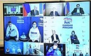 Participants of the online social forum of the United Russia political party via videoconference.
