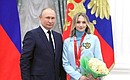 At ceremony for presenting state decorations to gold medallists of the XXIV Olympic Winter Games in Beijing. Viktoria Sinitsina, the 2022 Winter Olympics gold medallist in team figure skating event, silver medallist in ice dancing, Merited Master of Sport of Russia, is awarded the Order of Friendship.
