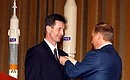 President Putin awarding the Star of the Hero of Russia to Cosmonaut Sergei Treshchev.