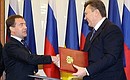 Signing of a Russian-Ukraine agreement on the presence of Russia's Black Sea Fleet on Ukraine territory. With President of Ukraine Viktor Yanukovych.