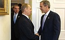 C. President Vladimir Putin and US President George W. Bush in the Oval Office.