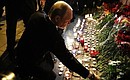 Vladimir Putin laid flowers in tribute to the victims of the metro explosion in St Petersburg.
