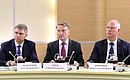 During a meeting with German business leaders. From left: CEO and Chairman of the Executive Board of Russian Railways Oleg Belozerov, CEO and Chairman of the Executive Board of Sberbank German Gref and CEO and Chairman of the Executive Board of the Russian Direct Investment Fund Kirill Dmitriyev.