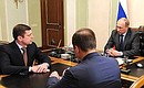 With Head of Roscosmos Oleg Ostapenko (left) and Deputy Head of Roscosmos Igor Komarov.