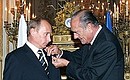 President of France, Jacques Chirac, awarded the Russian head of state the Legion of Honour Award.