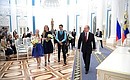 At a ceremony in the Kremlin, Vladimir Putin presented passports to young citizens of Russia.
