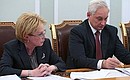 At the meeting on health care development. Healthcare Minister Veronika Skvortsova and Presidential Aide Andrei Belousov.