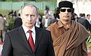 With leader of the Libyan Revolution Muammar Gaddafi.