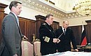 President Putin with Defence Minister Sergei Ivanov and Commander-in-Chief of the Navy Vladimir Kuroyedov.
