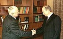 President Putin with Anatoly Pristavkin, an advisor to the President on pardon issues. Photo: TASS