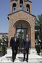 With President of South Ossetia Eduard Kokoity near the monument for victims of the Gergian — Ossetian military conflict. 
