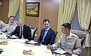 At the Khmeimim air base in Syria. With the Russian and Syrian military who took part in the counterterrorism operation.