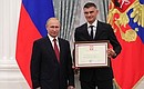 A letter of recognition for contribution to the development of Russia football and high athletic achievement is presented to Russia national football team player Vladimir Gabulov.