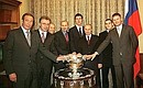 President Putin with the national tennis team, its trainer Shamil Tarpishchev and Vyacheslav Fetisov, State Sports Committee head, left.