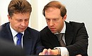 At a meeting on developing high-speed railways. Transport Minister Maxim Sokolov (left) and Industry and Trade Minister Denis Manturov (right).