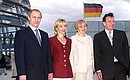 President Vladimir Putin and his wife Lyudmila, Gerhard Schroeder and his wife Doris Schroeder-Kepf on the roof of the Reichstag building.
