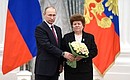 Presentation of state decorations. Zoya Fedotova, ship insulation worker at the Alexei Gorky Zelenodolsky Plant, is awarded the honorary title of Merited Machine Builder.