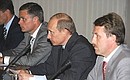 At a session of the State Council presidium on issues of developing the agro-industrial complex. To the left of the President, Presidential aid Aleksandr Abramov, to the right, the Minister for agriculture Alexey Gordeev.