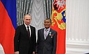 Presenting Russian Federation state decorations. The Order of Friendship is awarded to senior sheepherder at Rodina Breeding Plant agricultural production cooperative Bazar Darmayev.