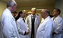 With doctors at the Sklifosovsky Research Institute of Emergency Medicine and Moscow Mayor Sergei Sobyanin (centre).