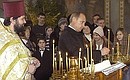 President Putin attending a Christmas service at the Church of the Sign of the Holy Mother of God.