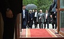 President of the Islamic Republic of Iran Hassan Rouhani arrives at the meeting with Vladimir Putin.