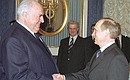President Vladimir Putin meeting with former German Chancellor Helmut Kohl.