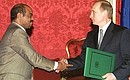 President Putin and Prime Minister of Ethiopia Meles Zenawi signing the Declaration on Principles of Friendly Relations and Partnership between Ethiopia and the Russian Federation.