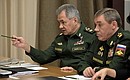 Before a meeting with Defence Ministry leadership and defence industry heads. Defence Minister Sergei Shoigu (left) and Chief of the General Staff – First Deputy Defence Minister Valery Gerasimov.